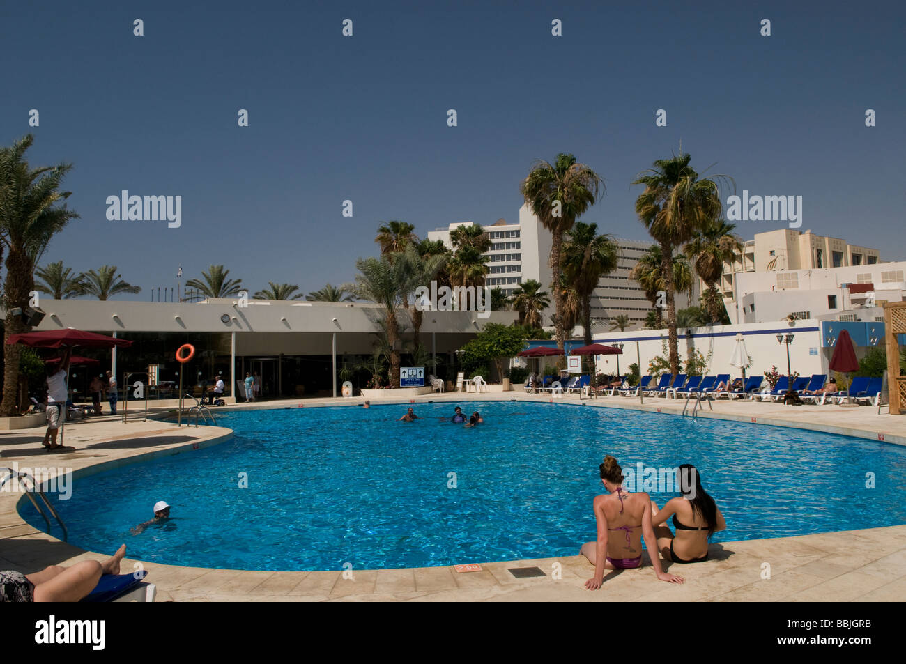 Holidaymakers in a hotel Swimming pool in Eilat a resort city at the  northern tip of the Red Sea, on the Gulf of Aqaba. Israel Stock Photo -  Alamy