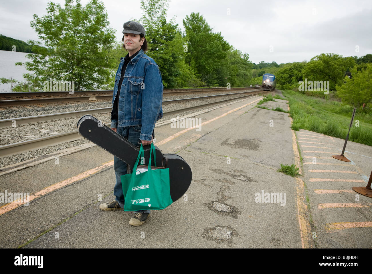 Musician Grant Hart formerly of seminal indy rock band Husker Du catching a train Amsterdam New York Stock Photo
