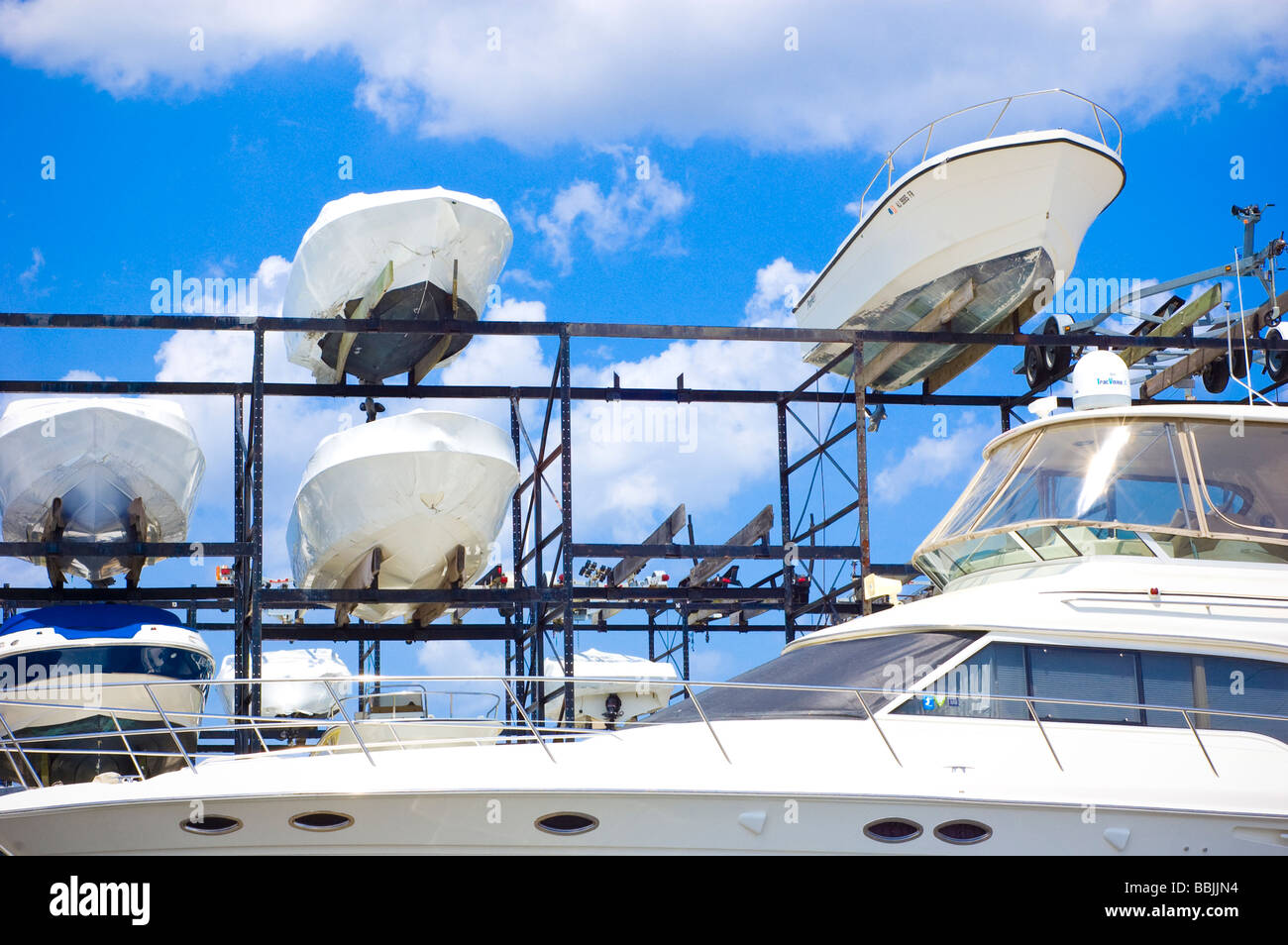 Low angle view of the hull of boats and yacht on a boat storage rack Stock Photo Alamy