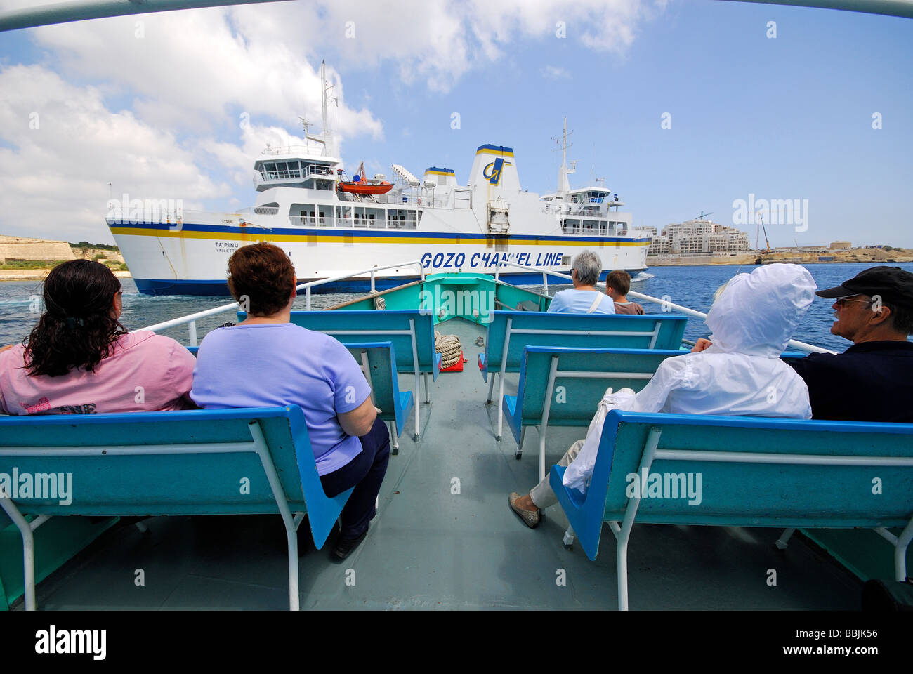 MALTA. Passengers on the Valletta to Sliema passenger ferry in Marsamxett Harbour, with the Gozo ferry ahead. 2009. Stock Photo