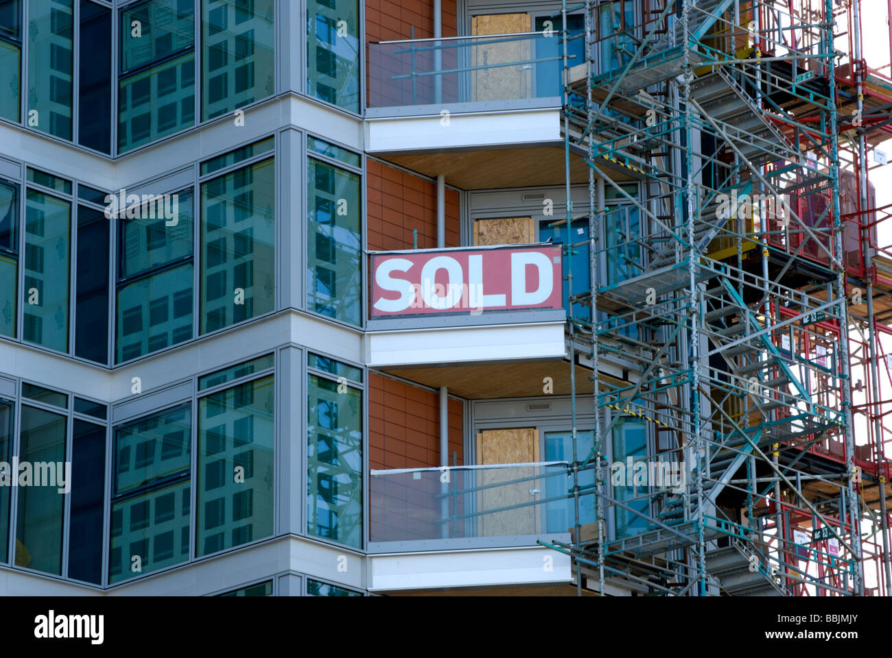 sold sign on partially built block of luxury flats at battersea reach