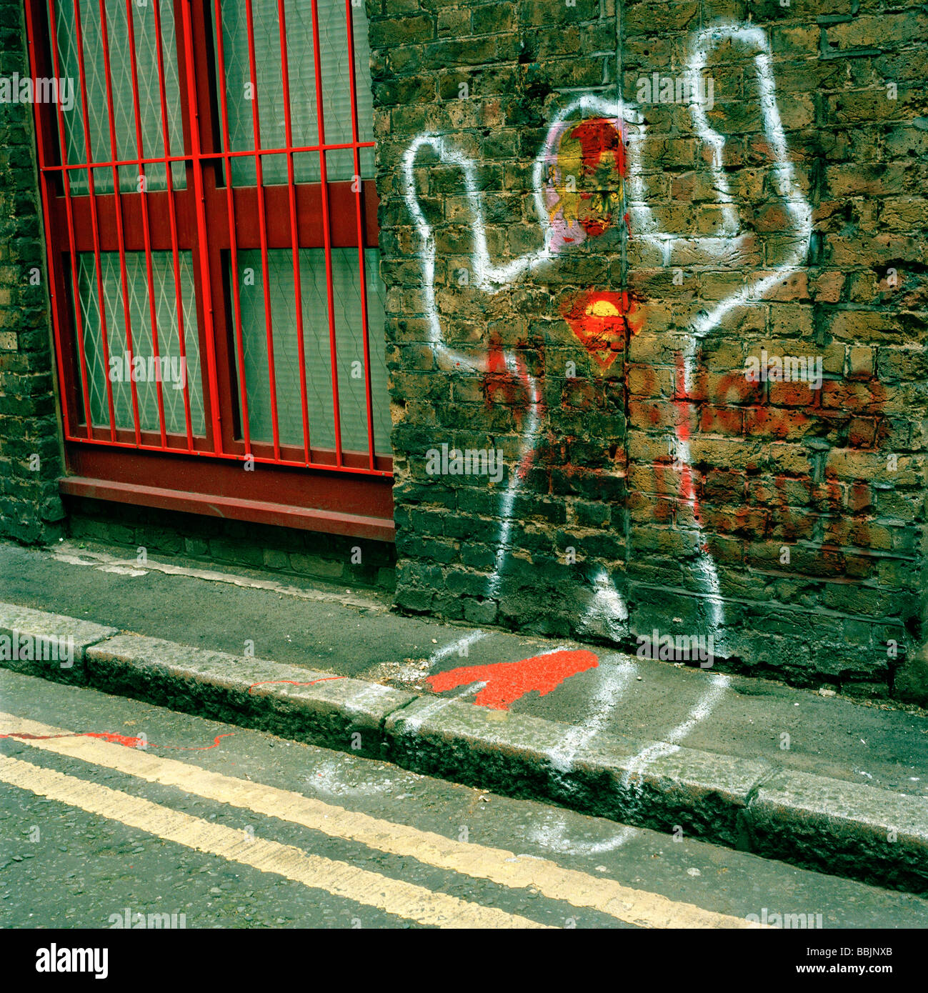 Outline of a man with a Superman symbol sprayed on a wall near Old Street, London Stock Photo