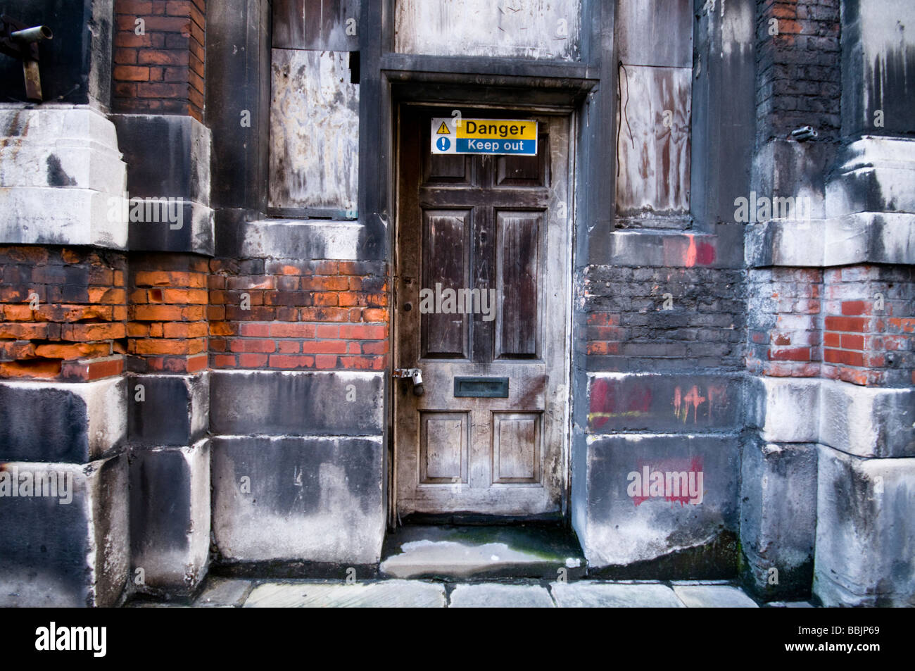 Entrance door of delapidated building, London, UK Stock Photo