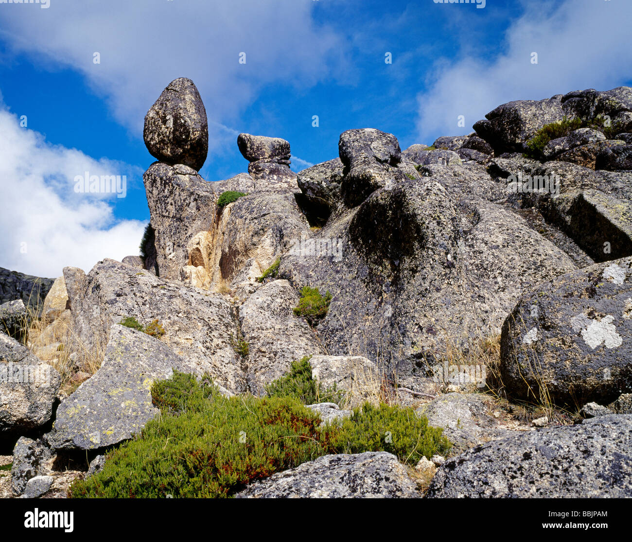 Balanced rock in a bizarre surreal rock formation in the National Reserve Parque Natural da Serra da Estrela Guarda Portugal Stock Photo