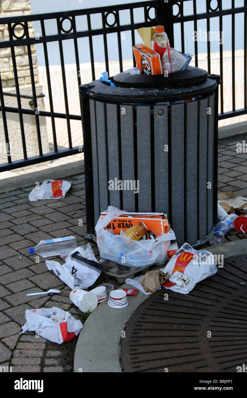 Overflowing trash rubbish bin in the town of Batavia Illinois USA Stock Photo