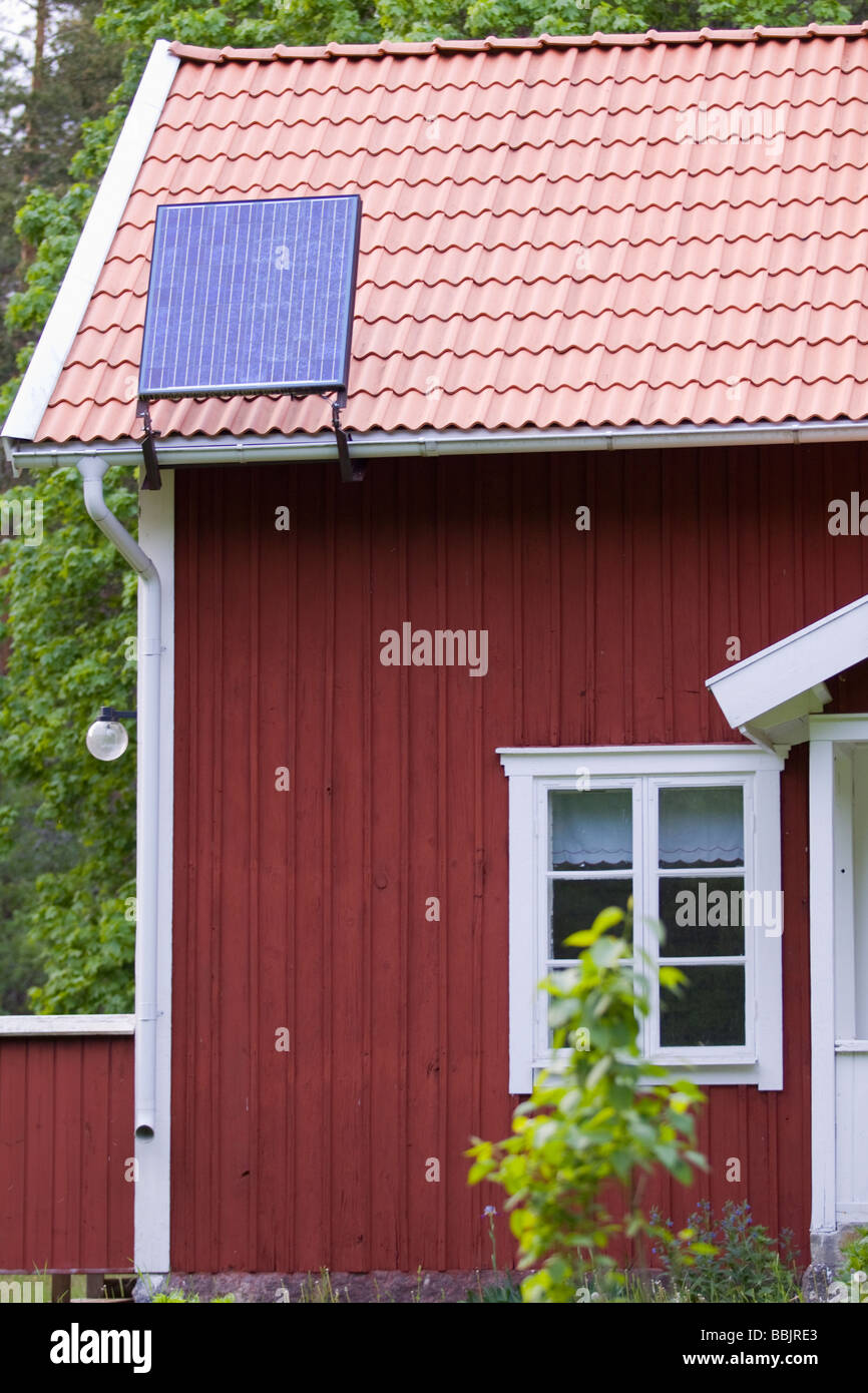 PV cell on roof on Swedish cottage. Stock Photo