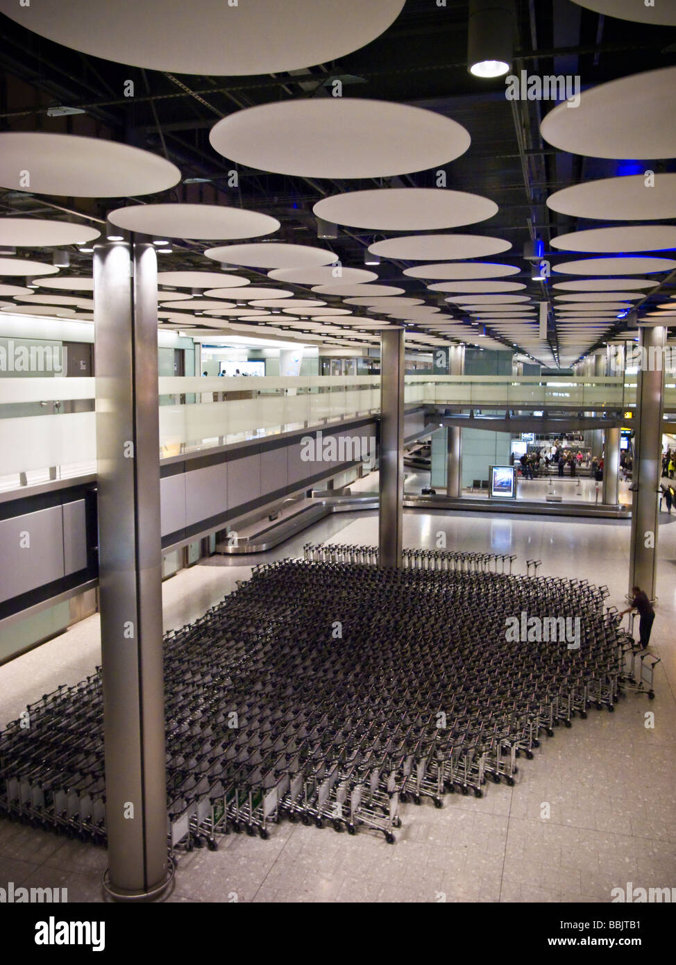 Trolleys in the baggage reclaim area (Ceiling is a grid of cicular