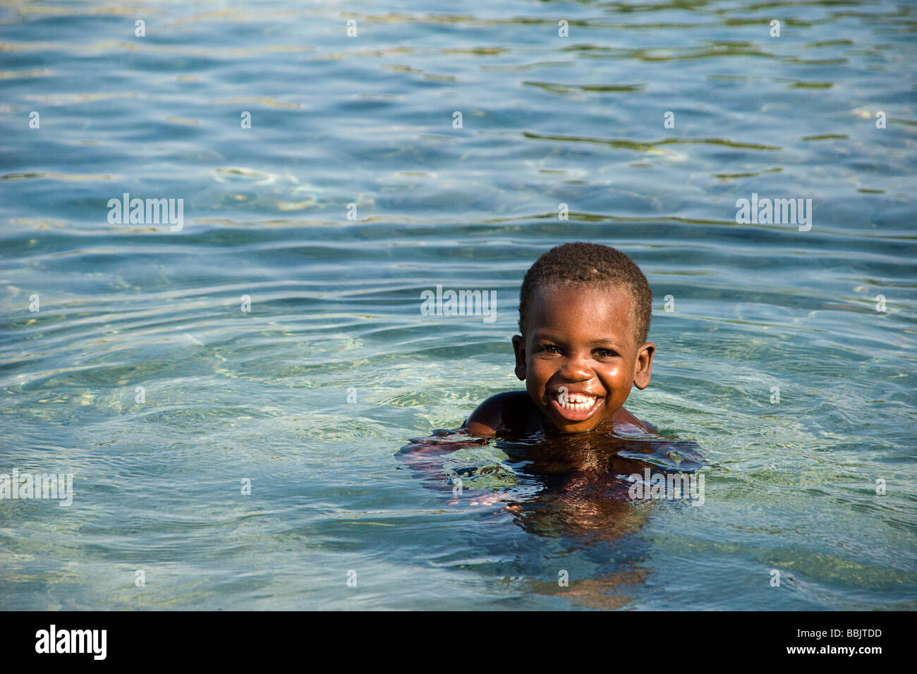 Happy smiling young happy haitian hi-res stock photography and images ...