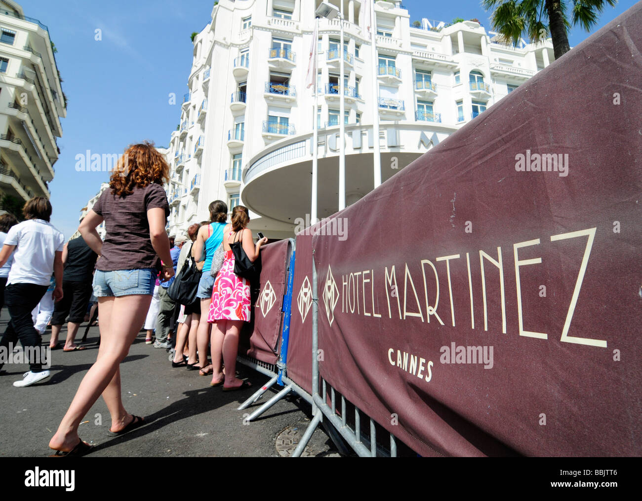 Fans waiting cinema celebrities outside the Martinez, a palace hotel in Cannes, France, during the Cannes film cinema. Stock Photo