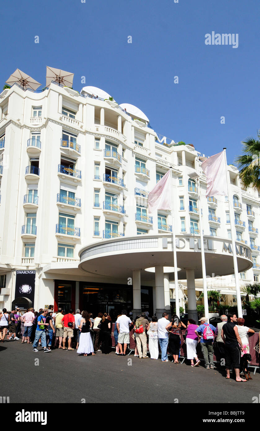 Fans waiting cinema celebrities outside the Martinez, a palace hotel in Cannes, France, during the Cannes film cinema. Stock Photo