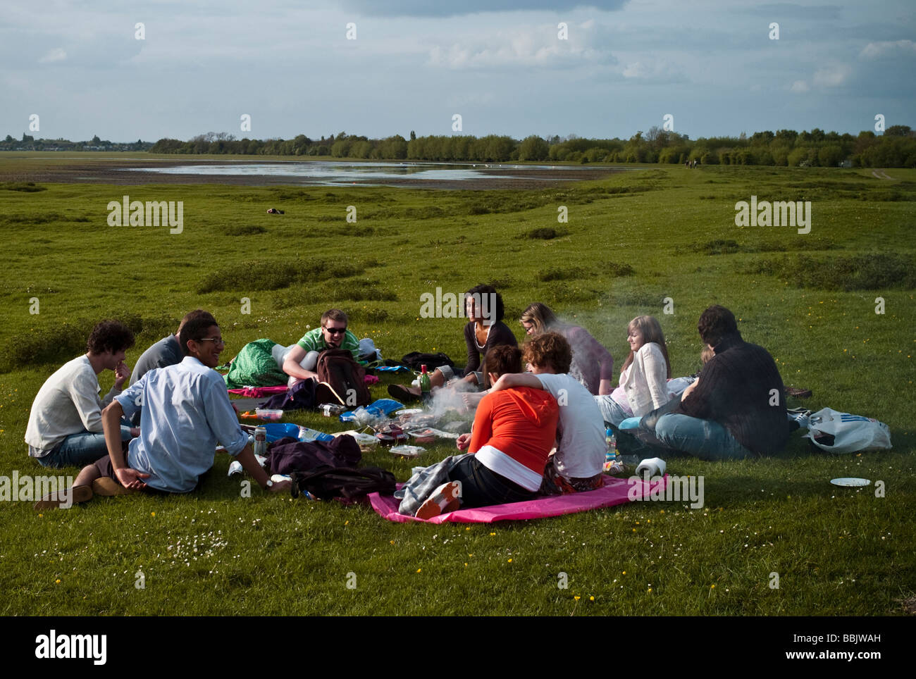 University students relaxing having a picnic and barbecue on the Port