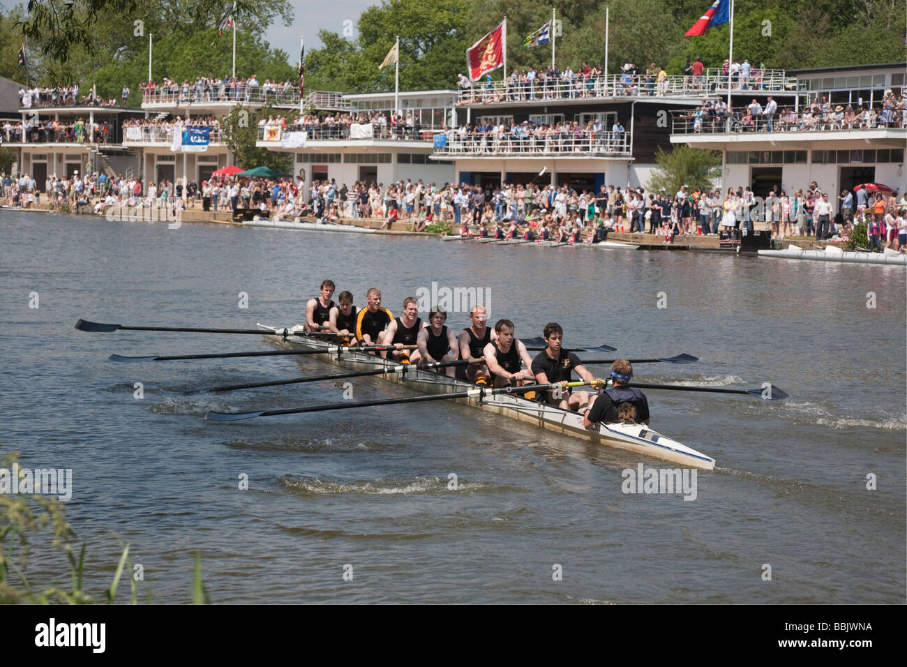 A men s college rowing crew racing at the Oxford University Eights Week