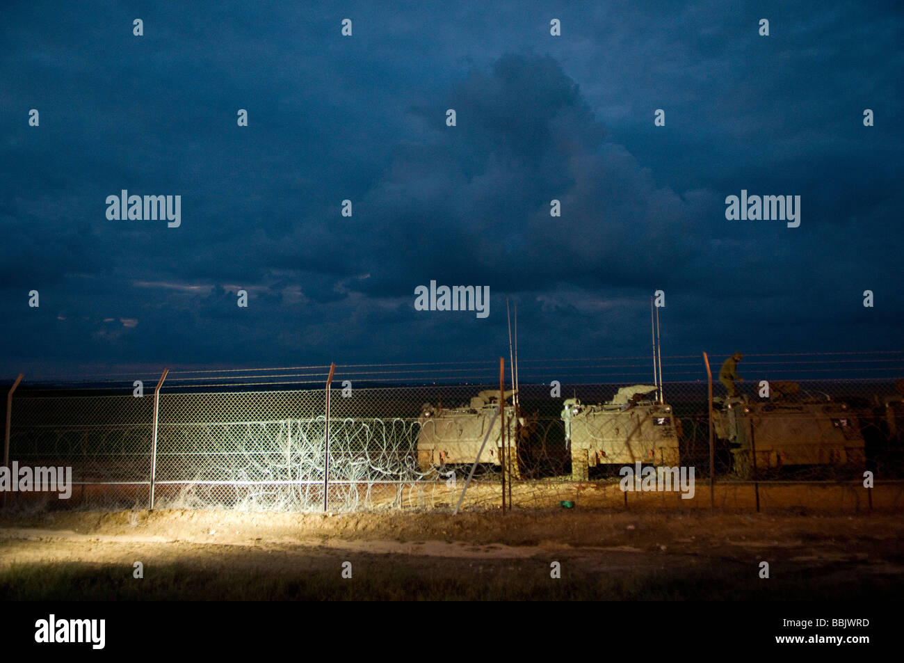 Israeli APC armoured personnel carriers at the Israel-Gaza border, waiting to deploy into the Gaza Strip. Stock Photo
