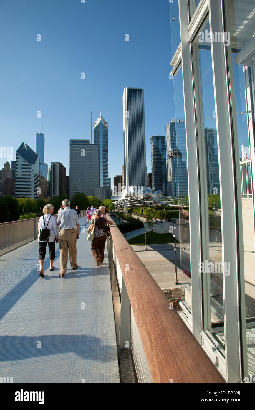 CHICAGO Illinois People walking on Nichols Bridgeway pedestrian bridge connecting Millennium Park with Modern Wing Art Institute Stock Photo