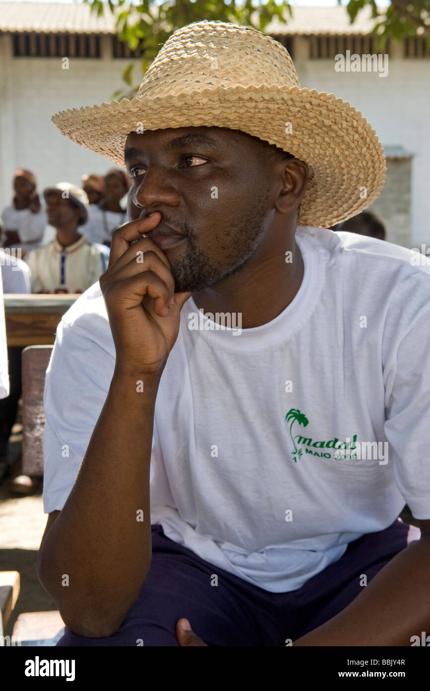 Man thoughtfully listening rests his chin on one hand Quelimane Mozambique Stock Photo