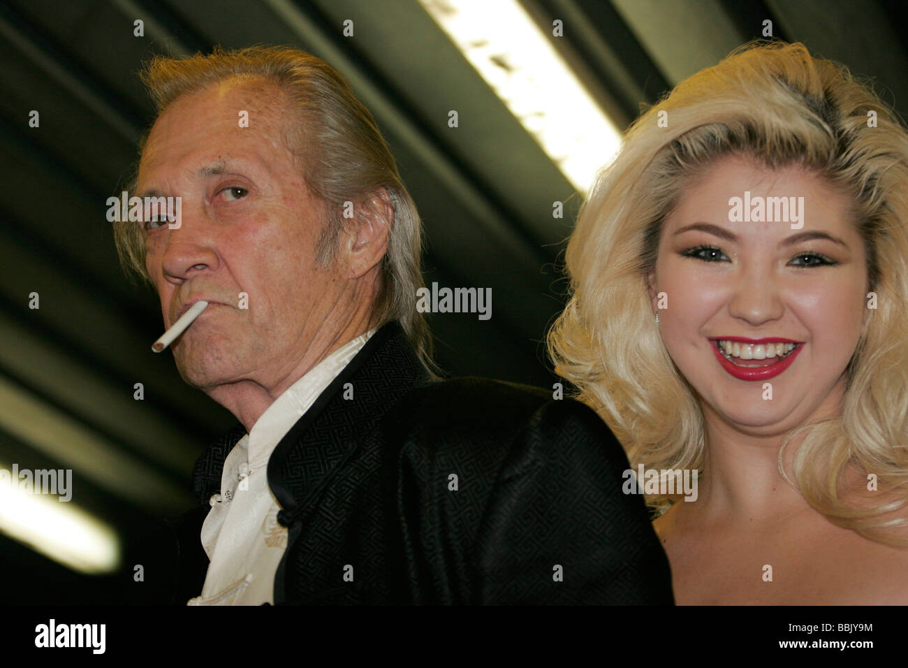 Famous Hollywood actor David Carradine is pictured smoking with smiling Kazakh actress at Eurasia film festival in Almaty, Kazakhstan fall 2006 Stock Photo