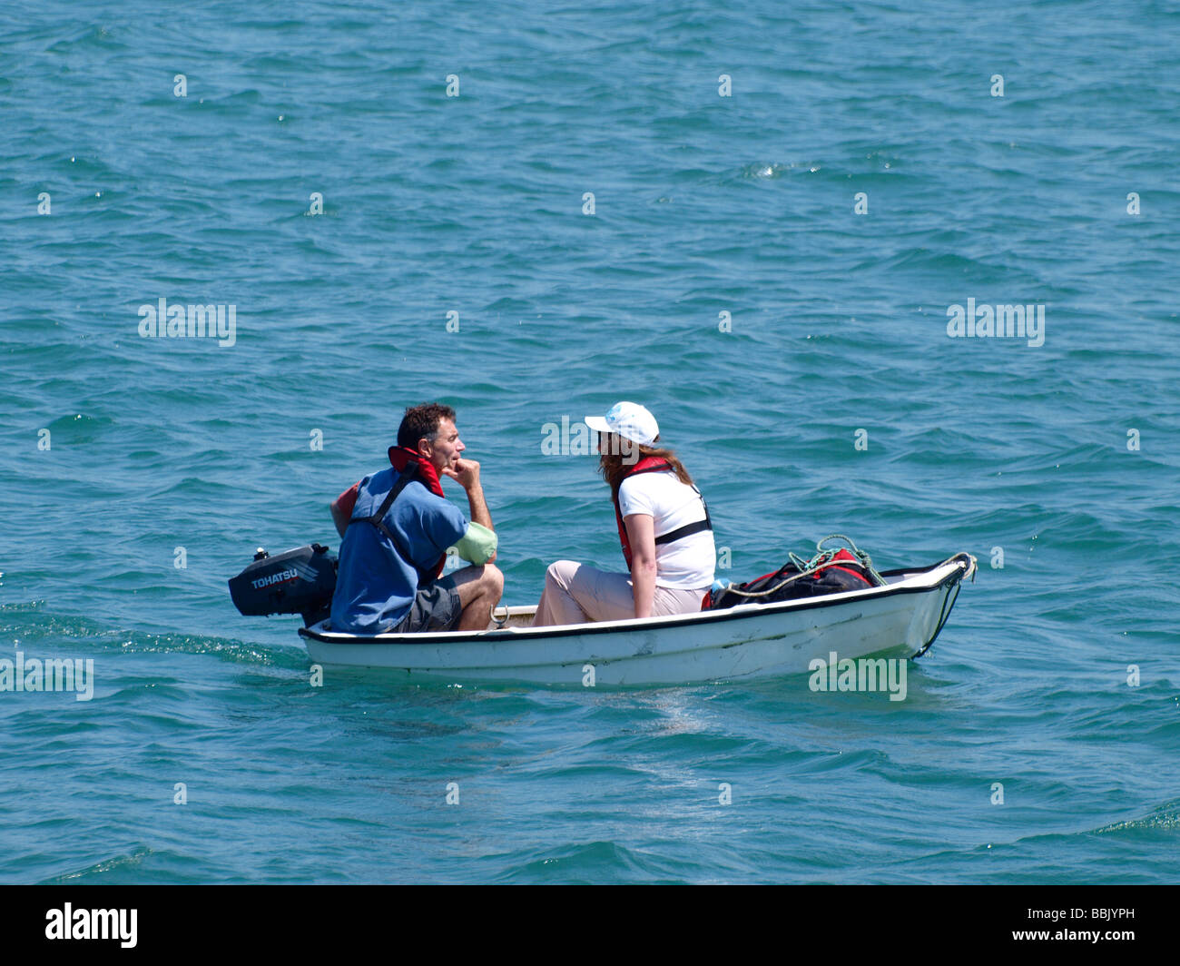 Couple in very small boat Stock Photo