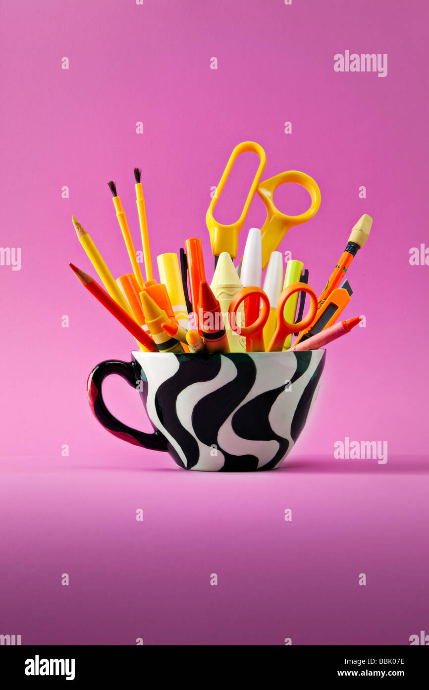 coffee mug of pencils and other desk paraphanalia Stock Photo