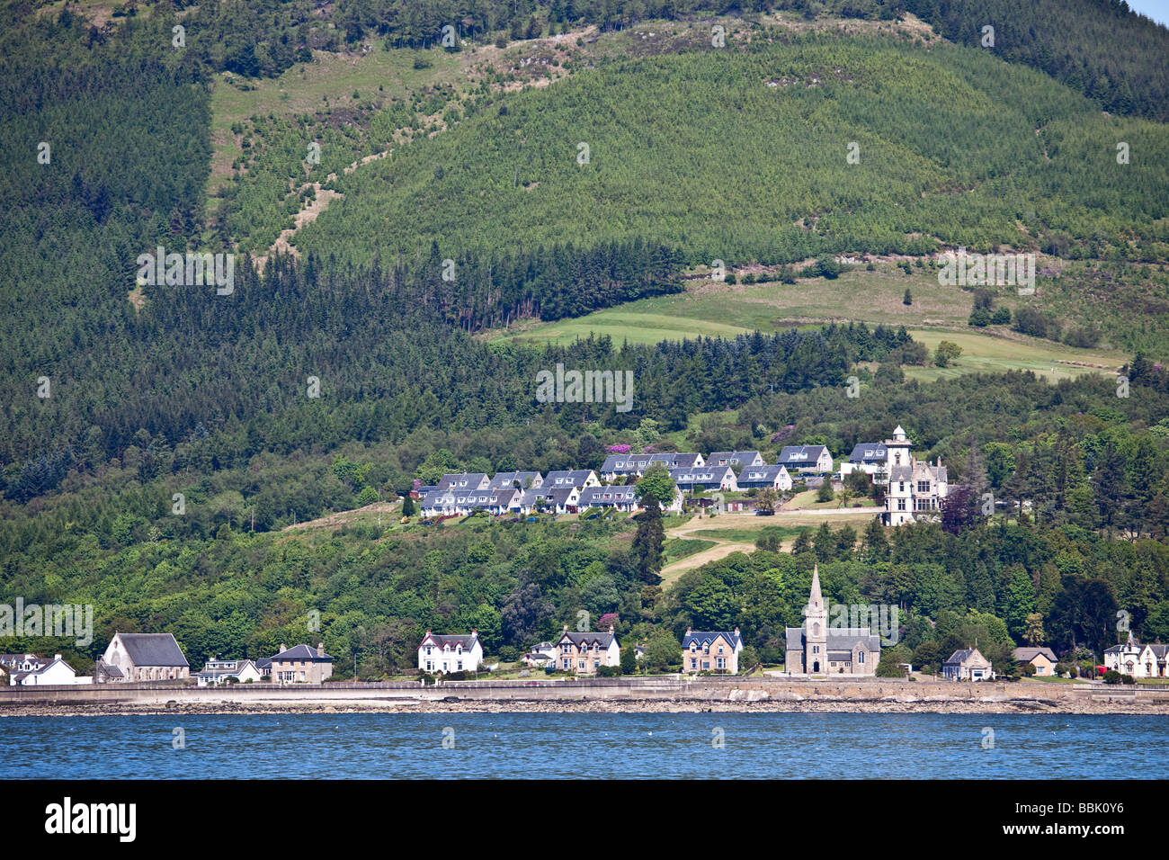 A view from offshore of the tiny village of Strone, on the Cowal Peninsula, Argyll, Scotland. Stock Photo