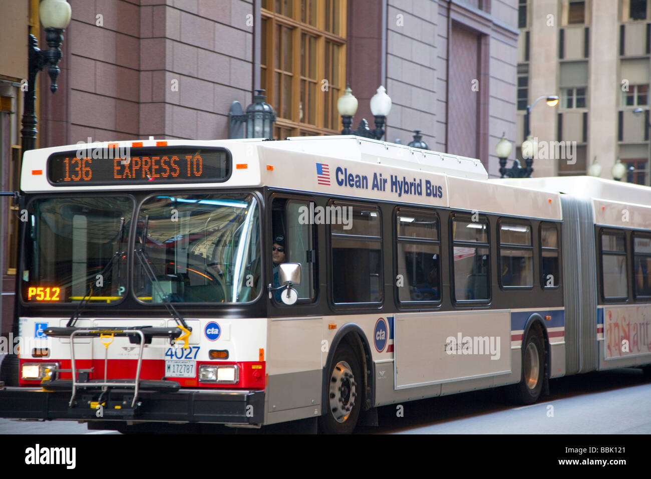Chicago Illinois A diesel electric hybrid bus in Chicago s Loop Stock