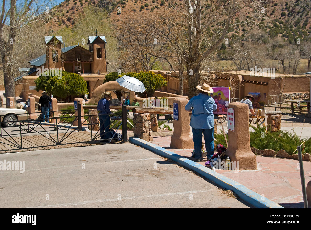 USA New Mexico Chimayo Santuario de Chimayo 4 artists paint the church scene Stock Photo Alamy