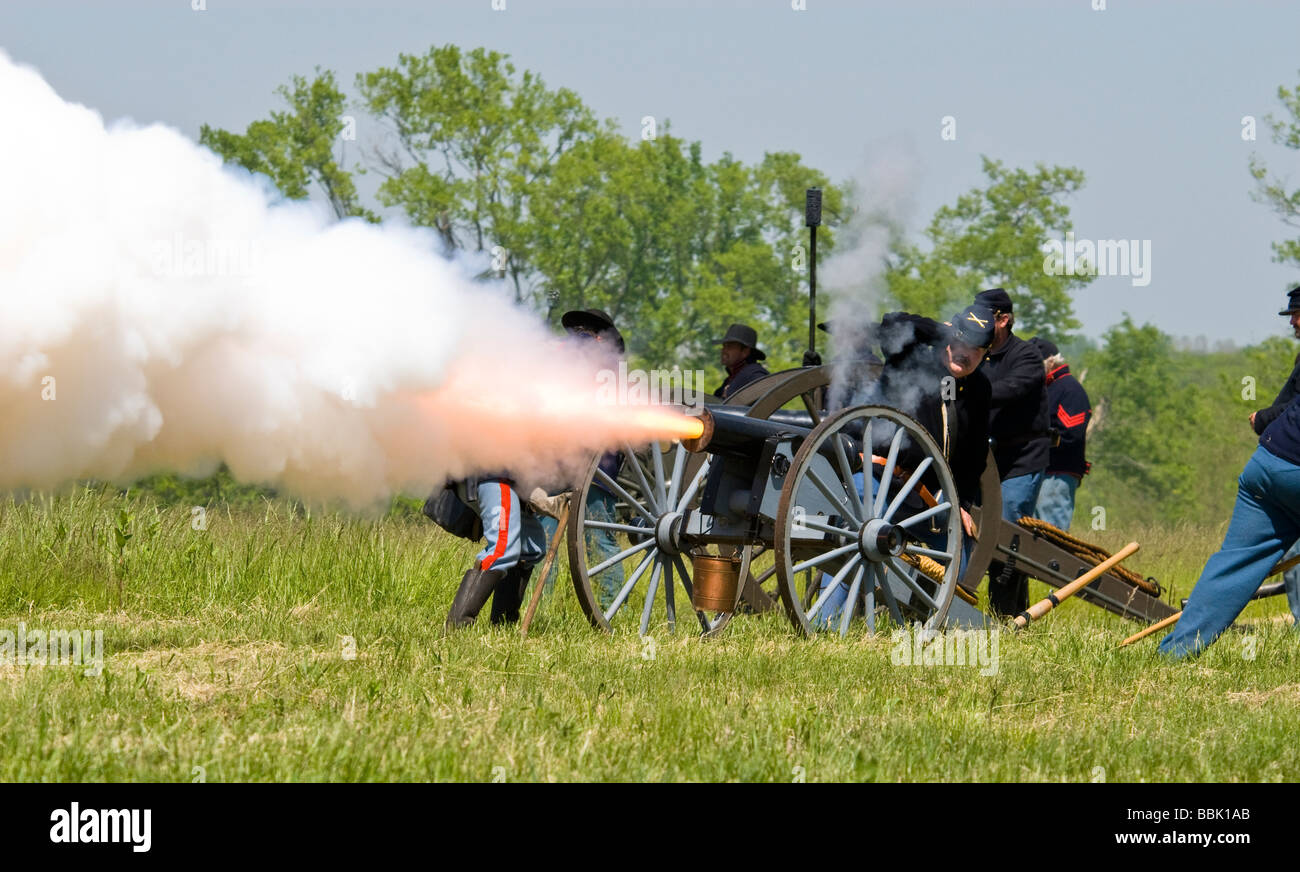 Union soldiers fire a canon in a reinactment of the Battle of Westport. Stock Photo