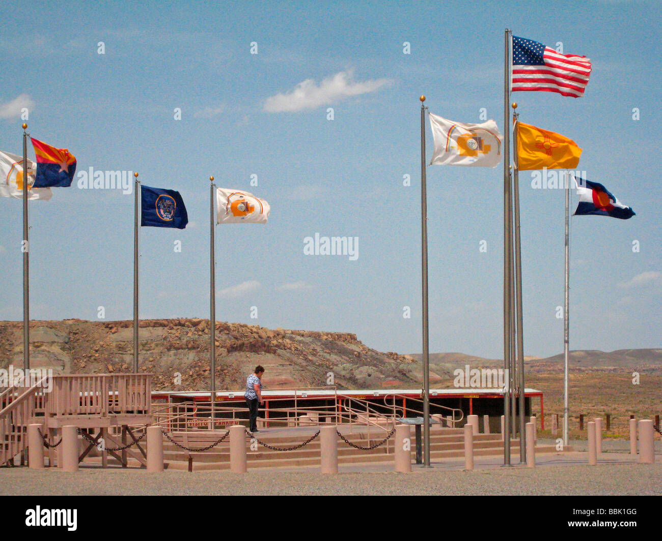 New Mexico Colorado Arizona Utah Four Corners Monument woman looks at