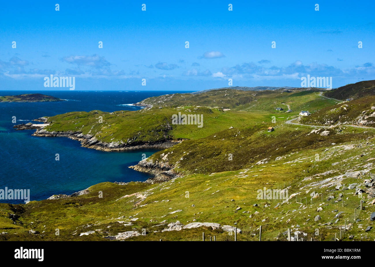 Wild and rocky coast line of North Harris Scotland as seen from the A887 with crofts Stock Photo