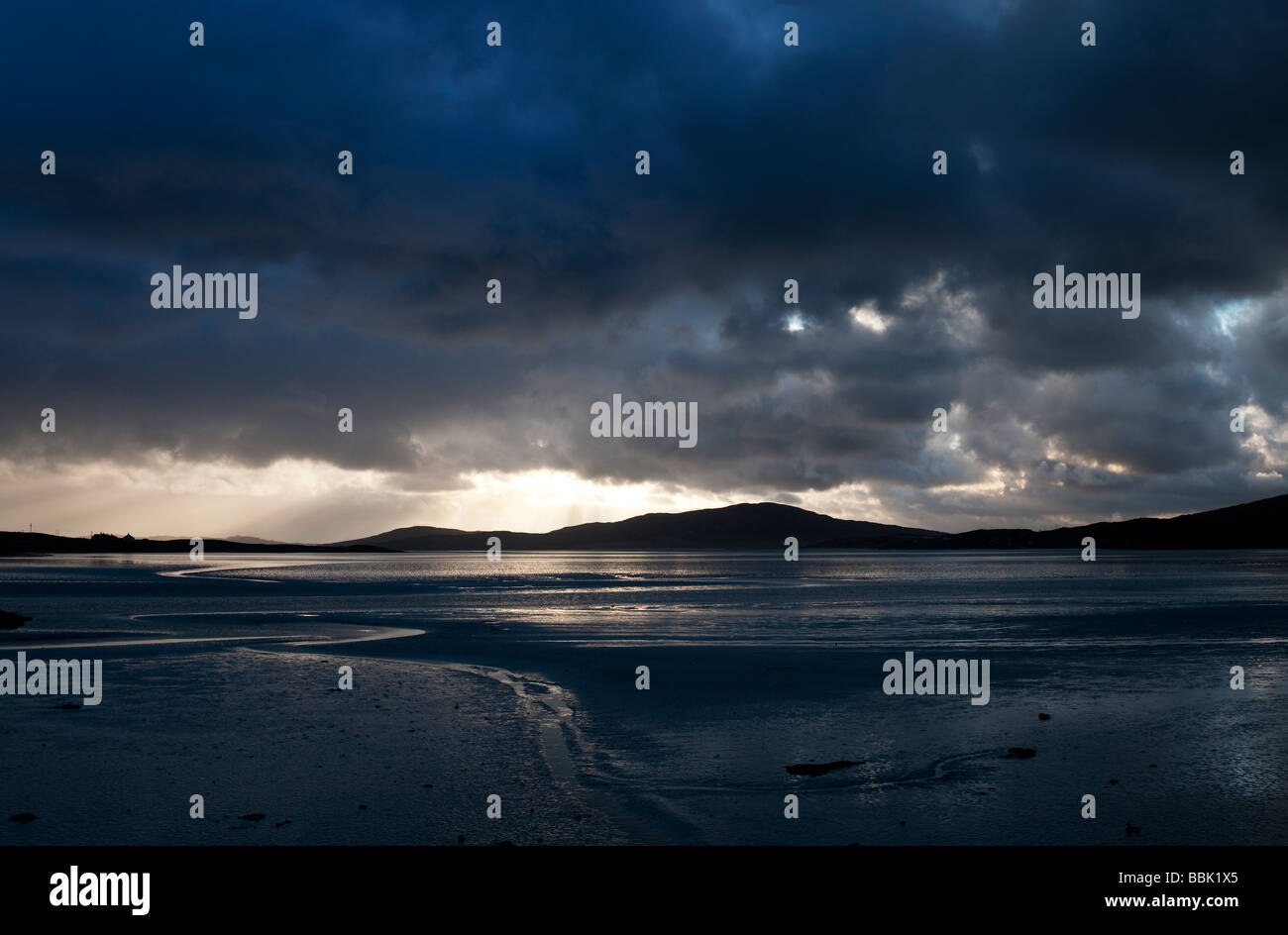 Sunset and storm clouds over Isle of Harris, Luskentyre beach, Outer Hebrides, Scotland Stock Photo