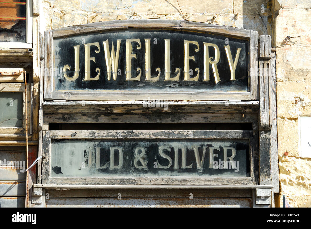 MALTA. An old wooden sign for a jewellery shop on Merchants' Street in Valletta. 2009. Stock Photo