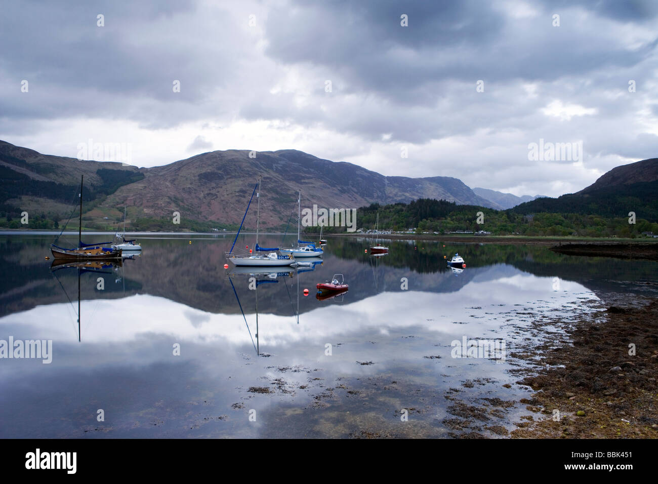 Sailboats Reflecting in Loch Leven, Glencoe, Ballachulish, Scotland. Stock Photo