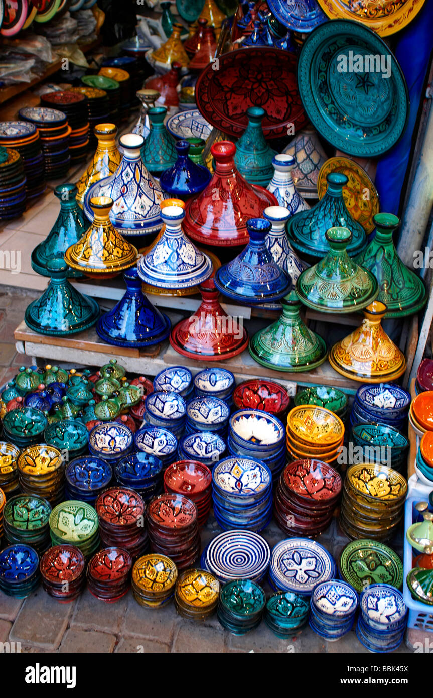 The busy souk with stalls selling decorative and colourful tagines in Marrakech Stock Photo