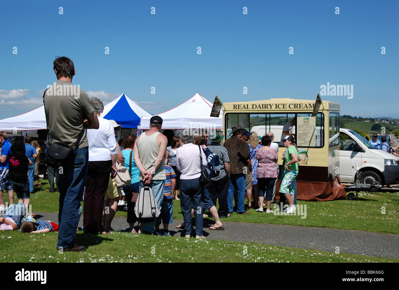 people queuing at an ice cream van in cornwall,uk Stock Photo