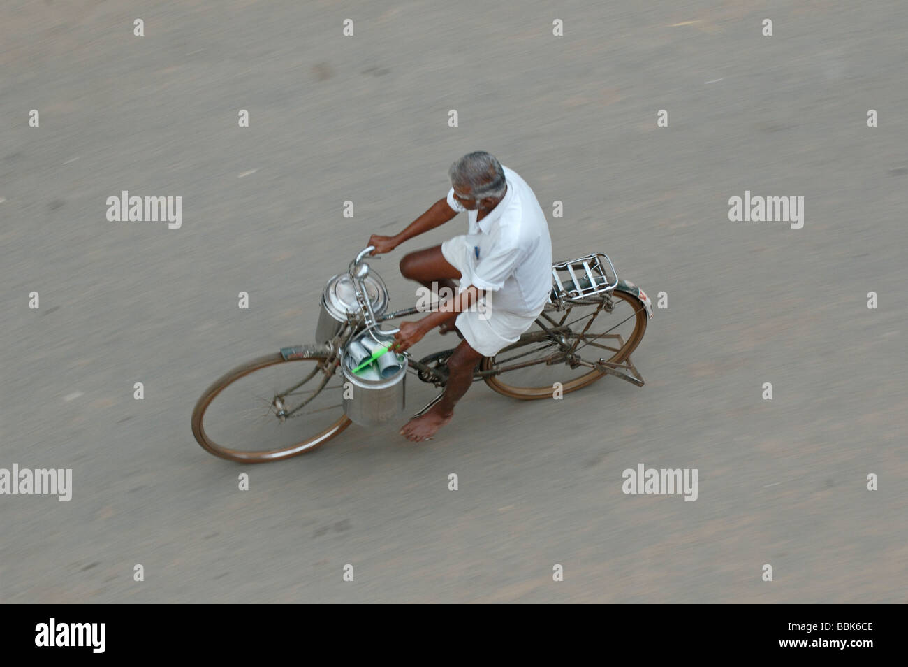 India, Tamil Nadu, Madurai. Indian man riding a bicycle. No releases available. Stock Photo