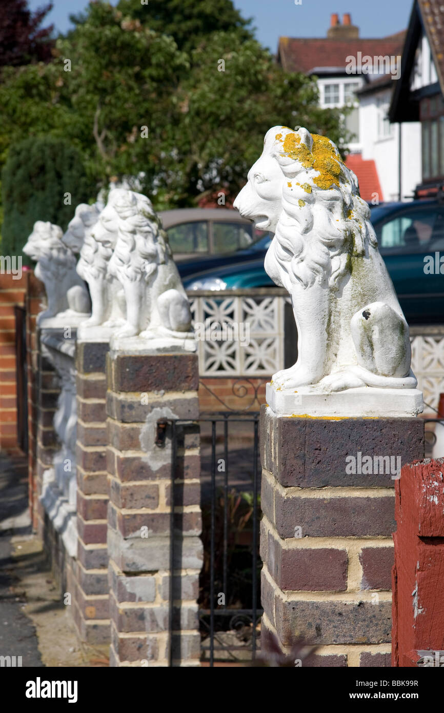 Decorative lion statuettes outside house in Pollards Hill North Norbury