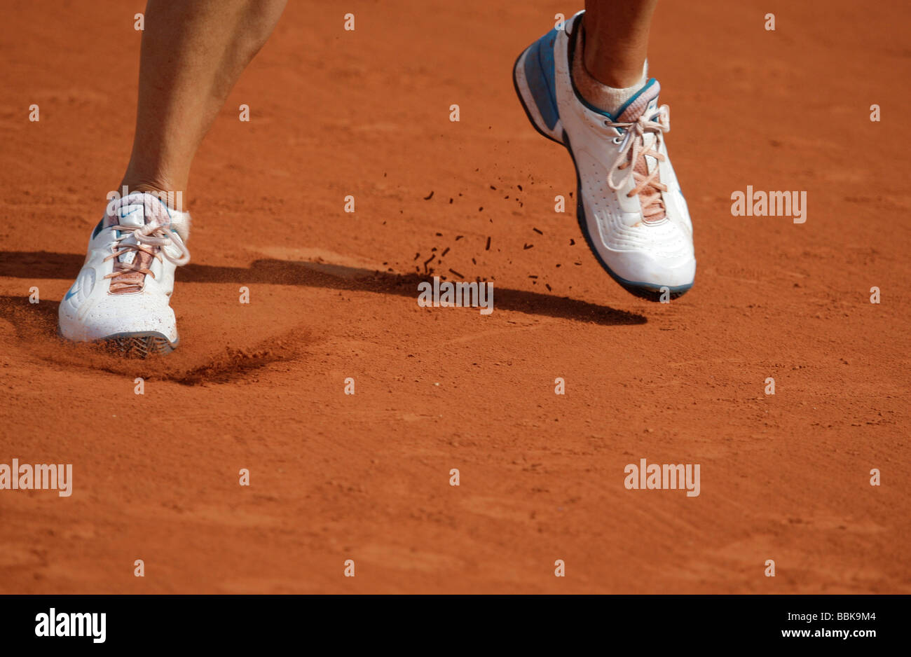 Tennis player Maria Sharapova's feet in her personalized shoes. Stock Photo