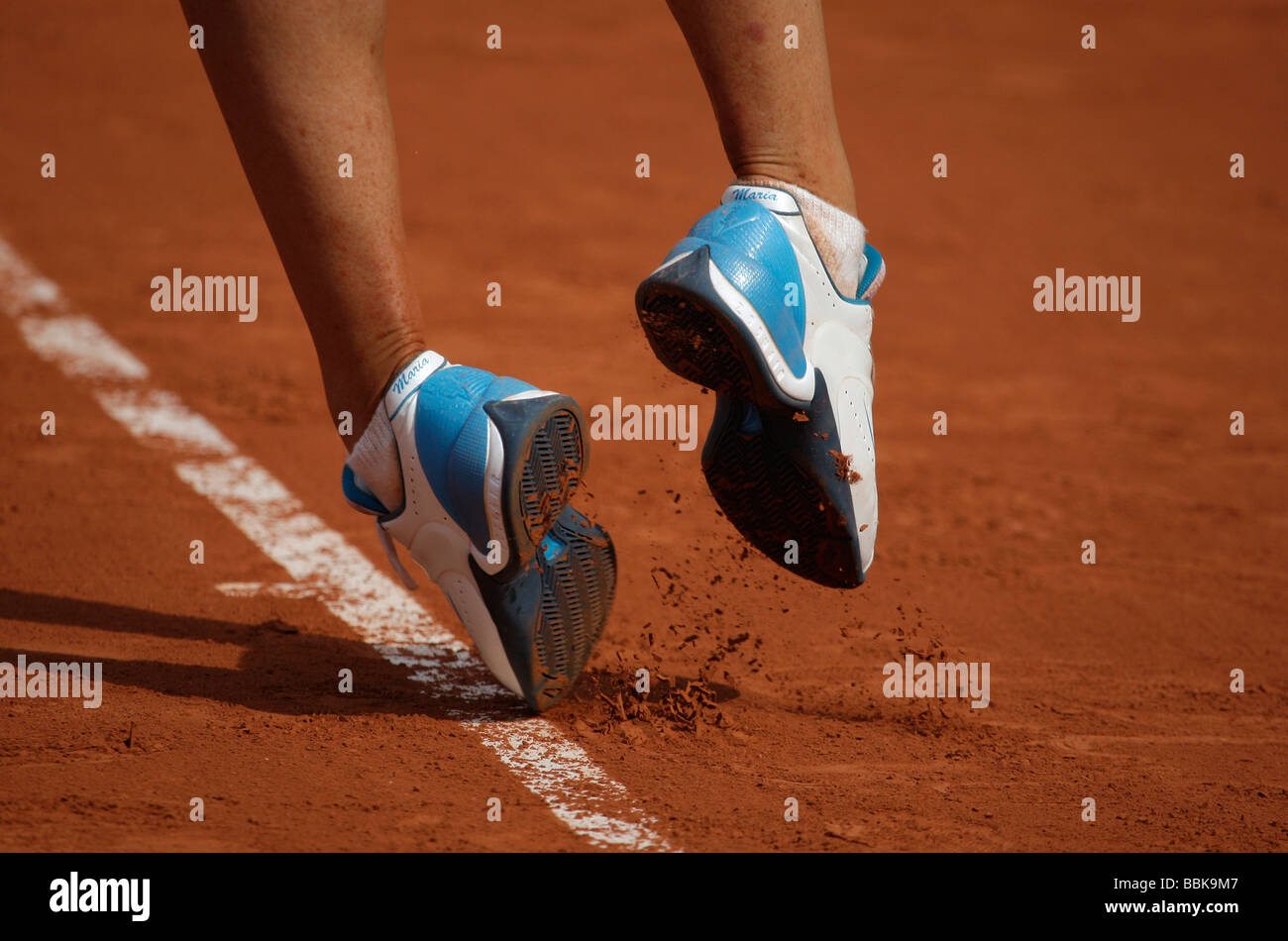 Tennis player Maria Sharapova's feet in her personalized shoes. Stock Photo