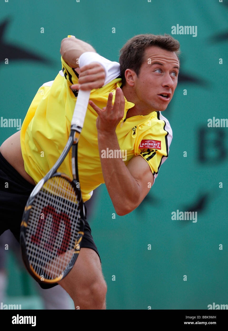 Tennis player Philipp Kohlschreiber playing a service at Roland Garros Stock Photo