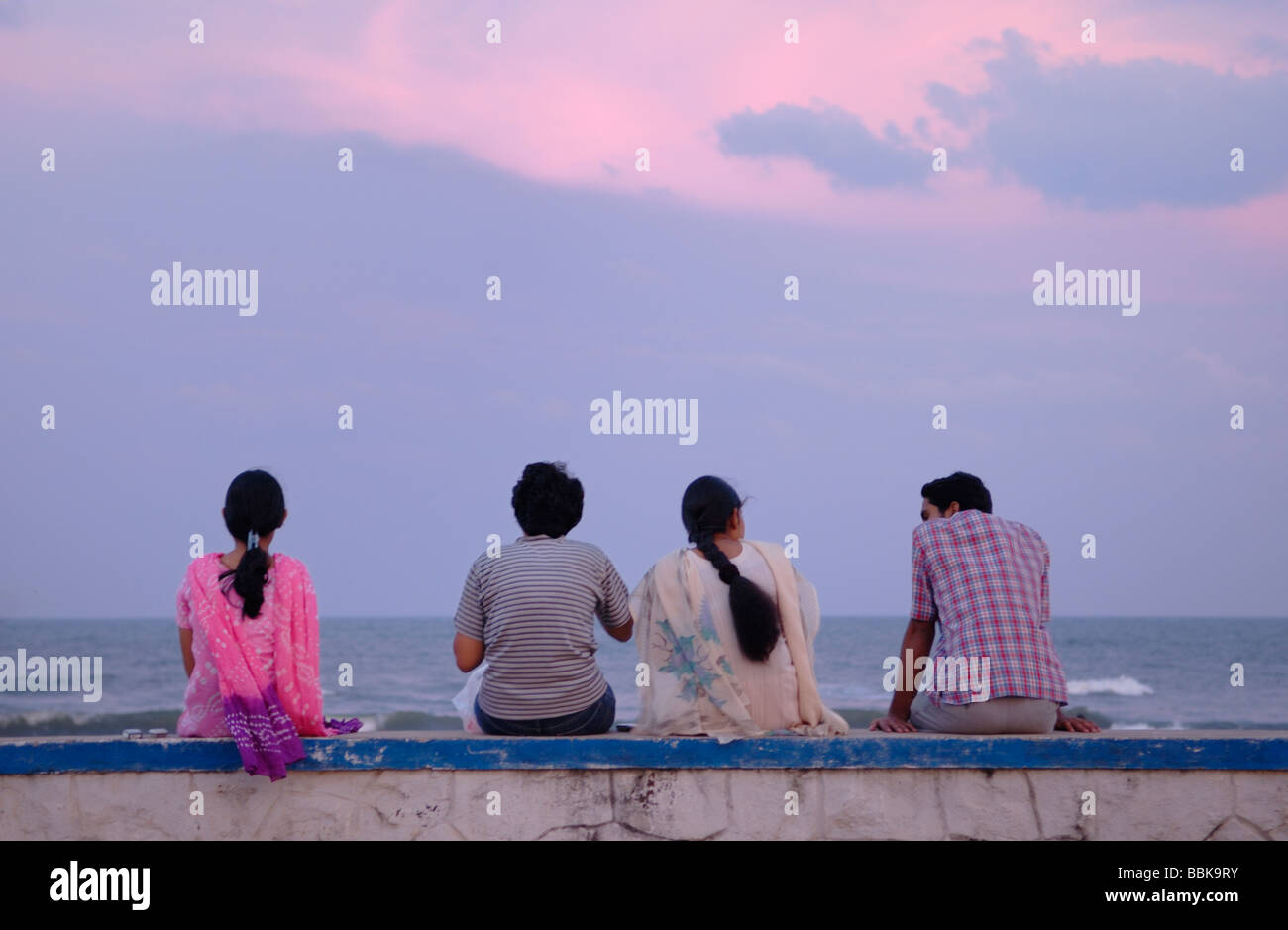 Group of Inadian people relaxing after sunset at Chennai beach. India, Tamil Nadu, Chennai (Madras).  No releases available. Stock Photo