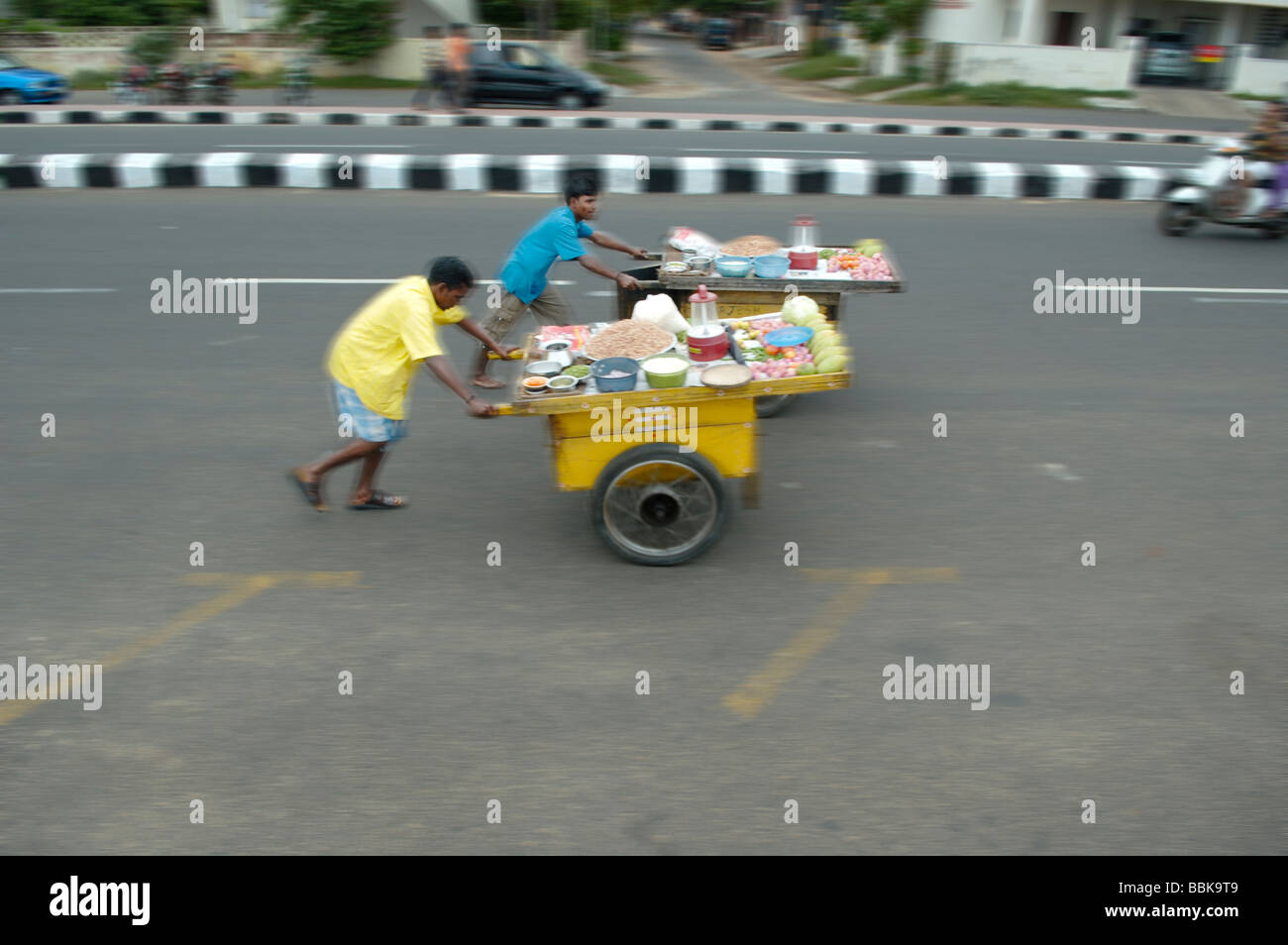 India, Tamil Nadu, Chennai (Madras). Small mobile shops being pushed along a major road in Chennai.  No releases available. Stock Photo