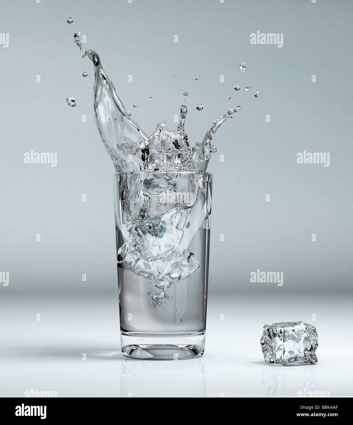 ice cube splashing into a glass full of water Stock Photo - Alamy