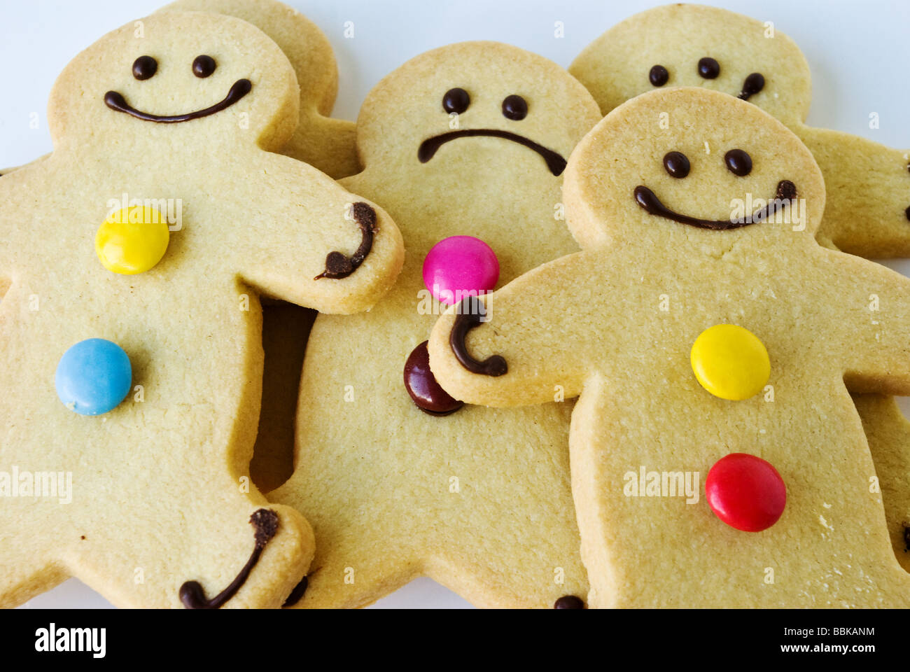 A gingerbread man is unhappy in a crowd Stock Photo