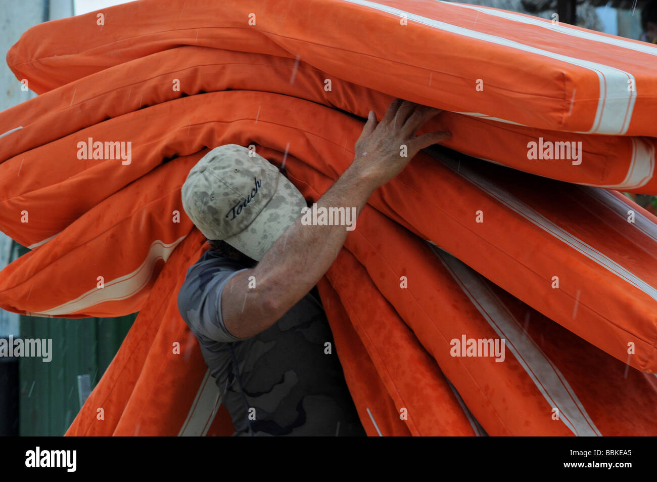 Man carrying mattresses on his shoulder Stock Photo Alamy