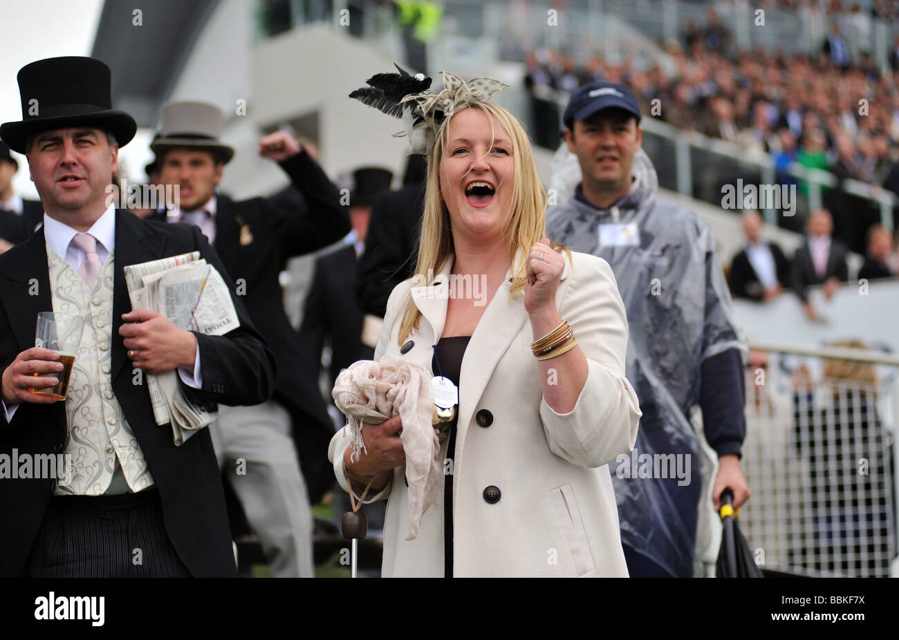 A woman race goer cheering on her winning horse at the Investec Epsom Derby 2009 Stock Photo