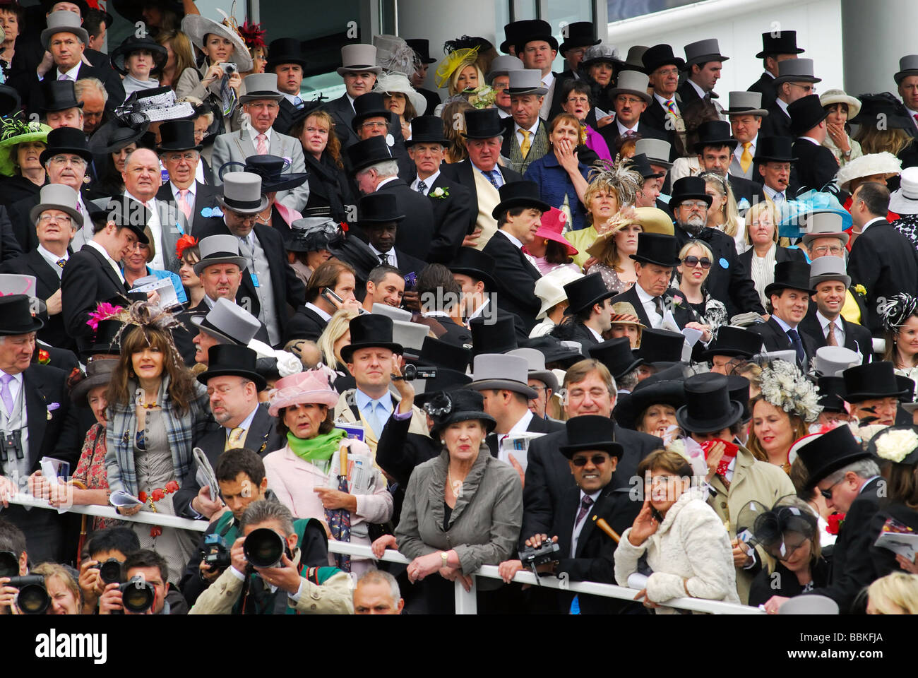 A crowd of top hatted men and elegantly dressed women race goers in the enclosure Derby Day 2009 Stock Photo