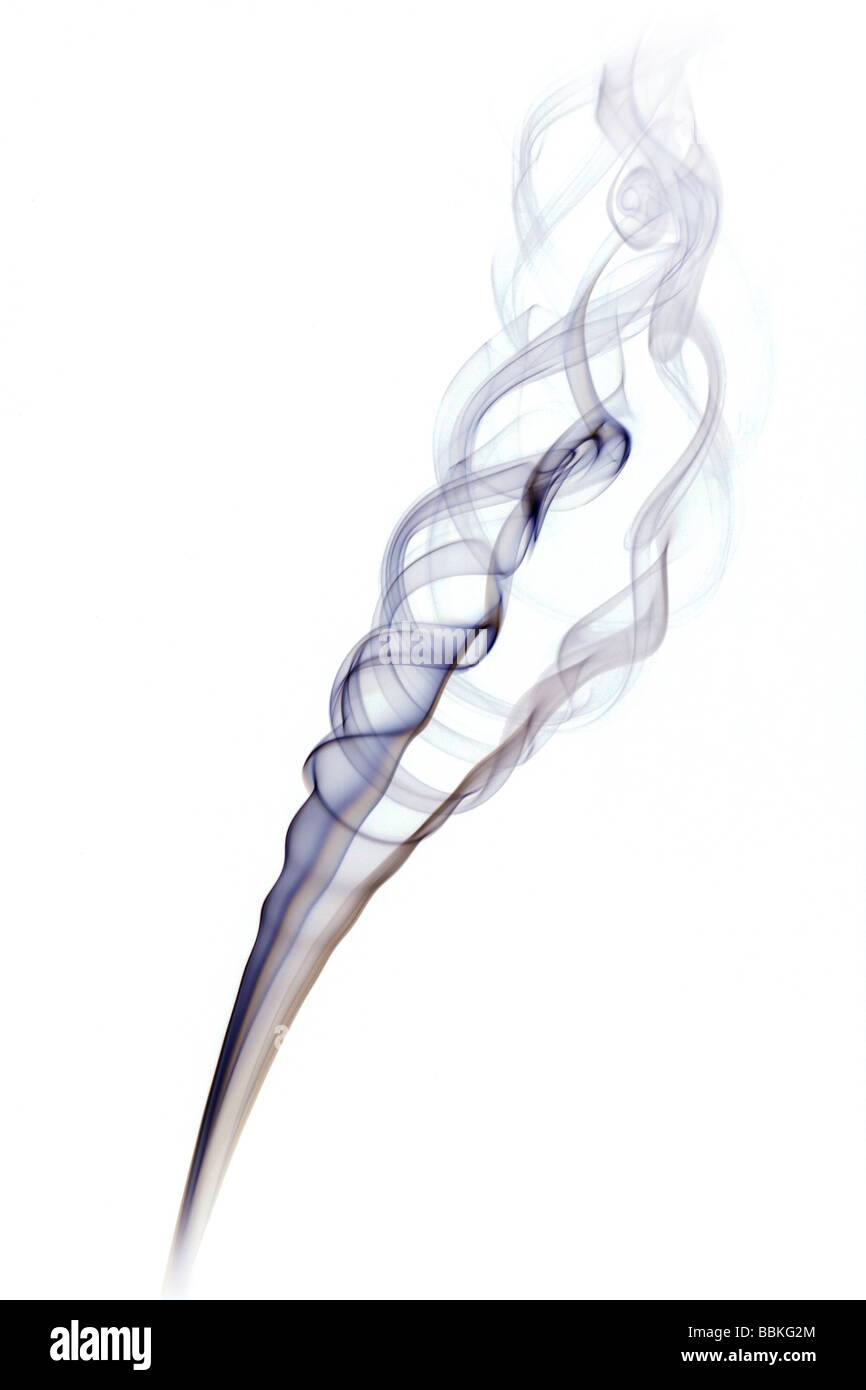 Curls of smoke given off by the combustion of an incense stick. Volutes de fumée dégagées par la combustion d'un bâton d'encens. Stock Photo