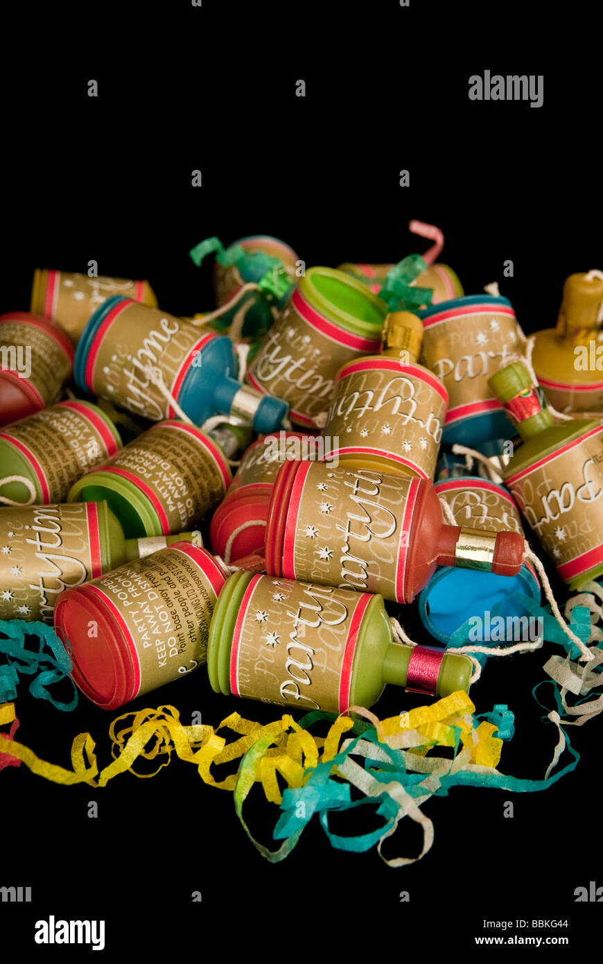Party poppers on black background, selective focus Stock Photo