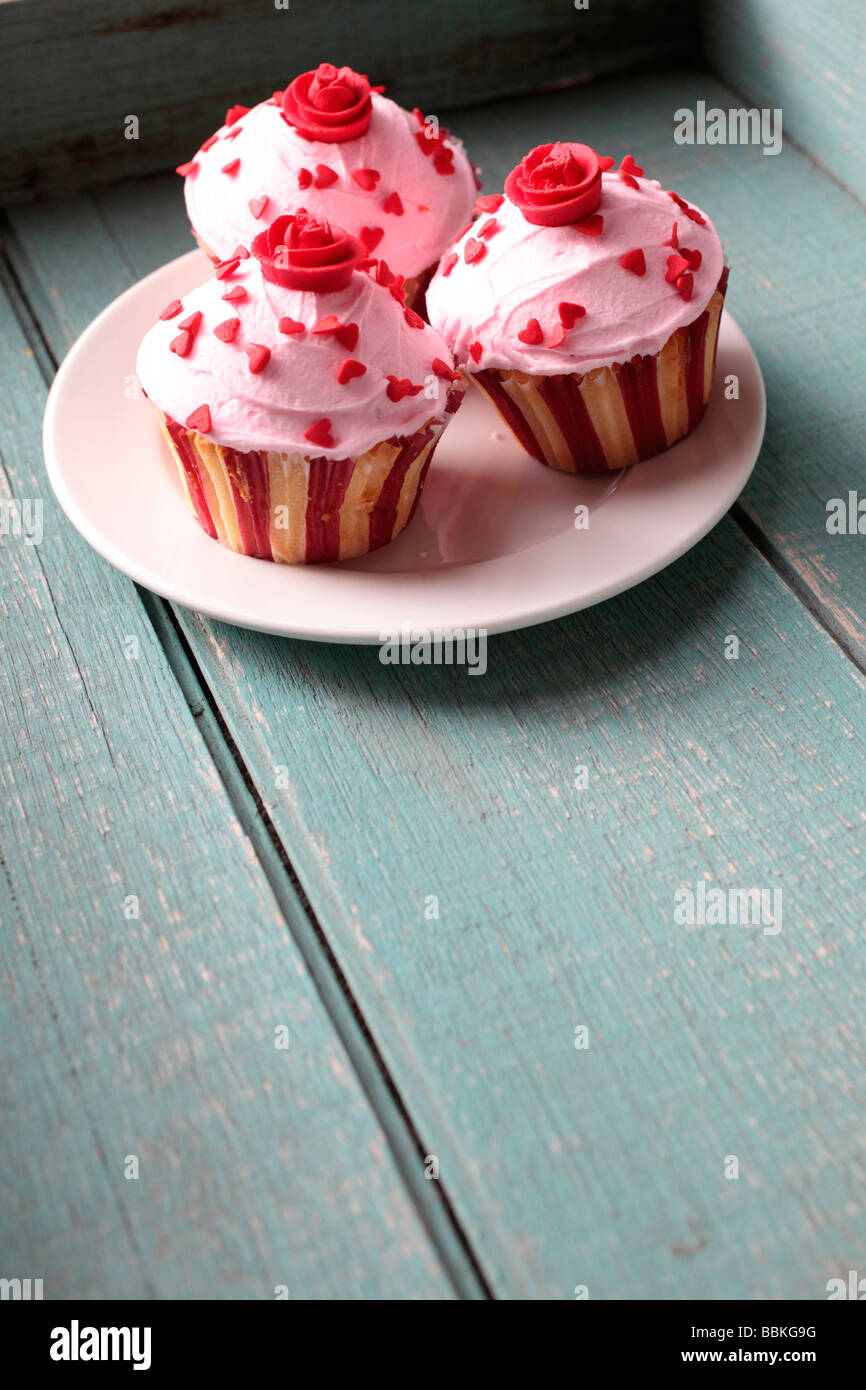 Wedding cupcakes covered in red hearts Stock Photo
