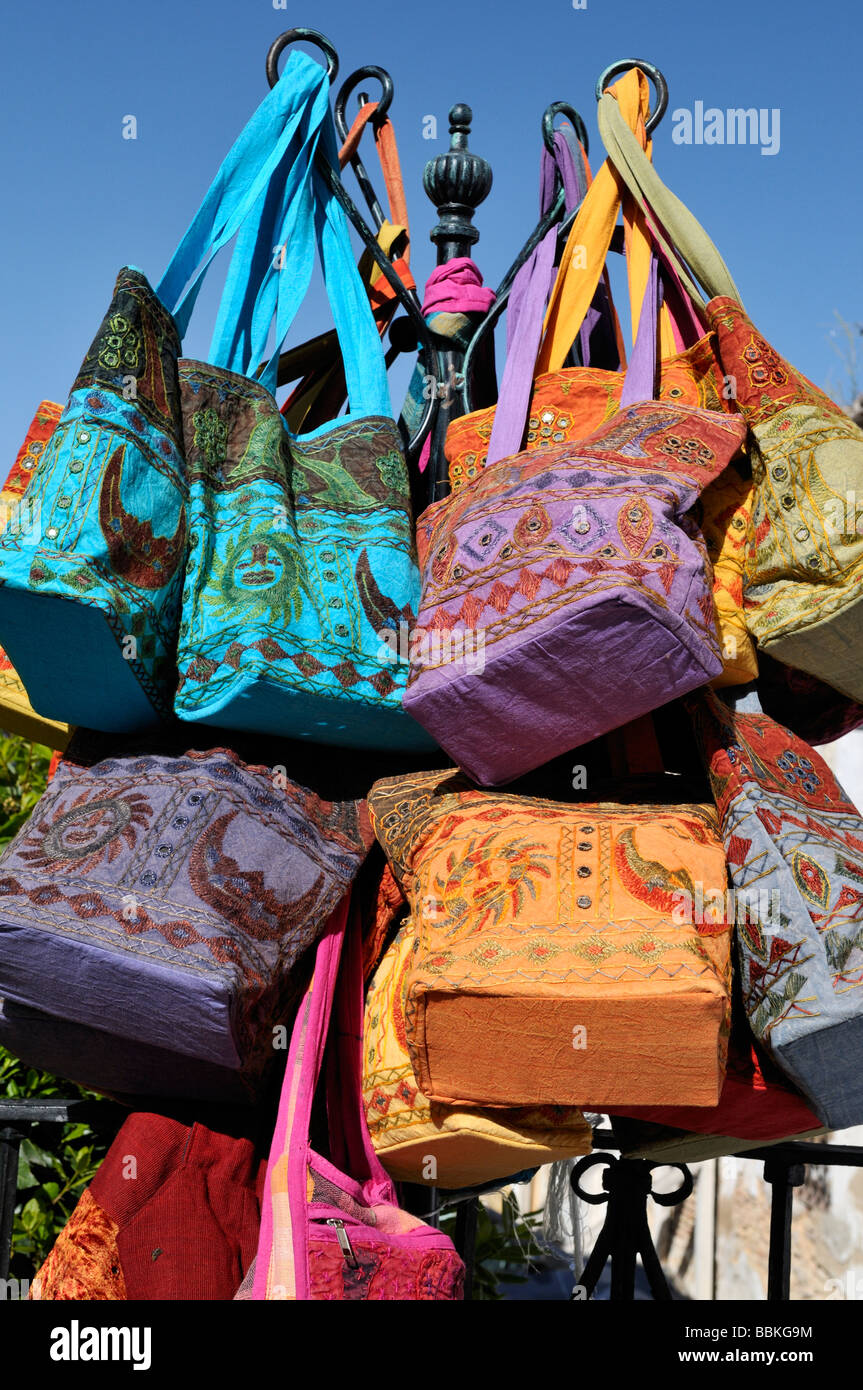 Colourful souvenir bags on display in Ronda Andalucia Spain Stock Photo