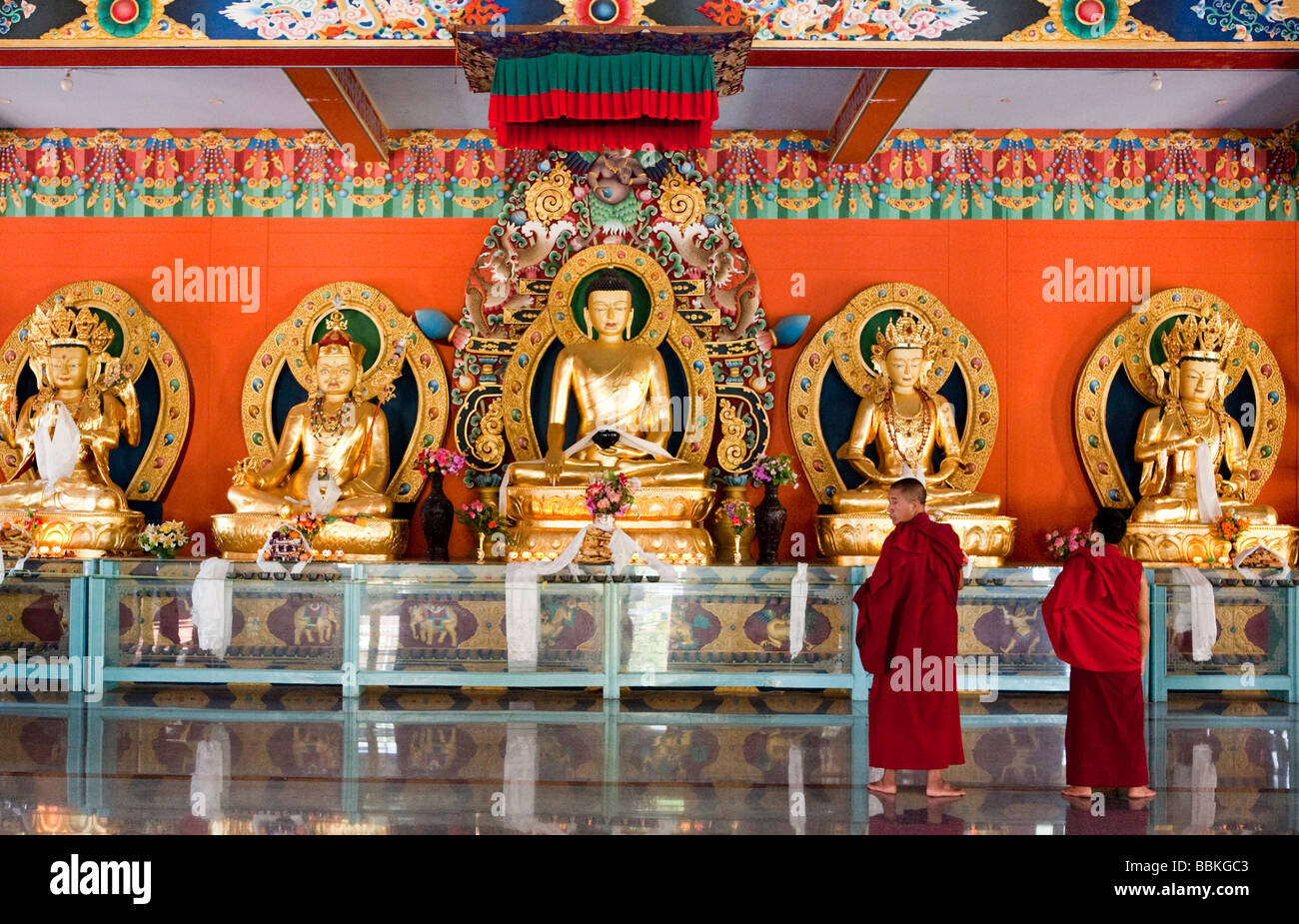 Monks By Golden Buddhas Namdroling Tibetan Monastery Bylakuppe Koorg Karbataka India Stock Photo
